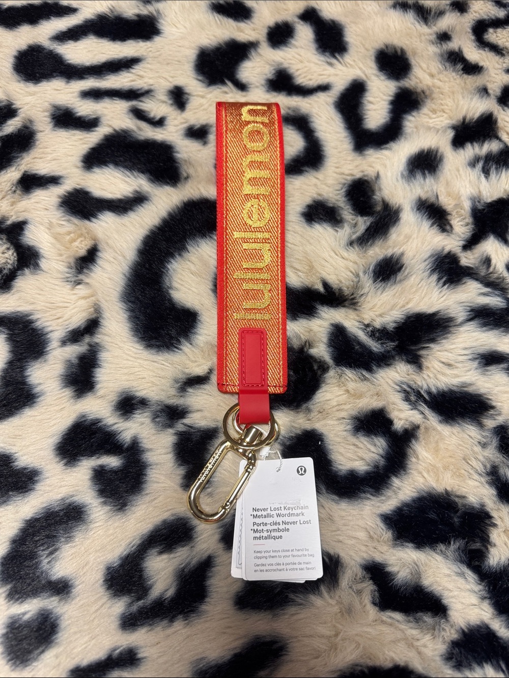 lululemon athletica Red and Gold Never Lost Keychain Wristlet